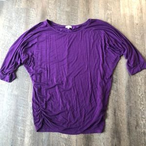 Purple dolman sleeved top